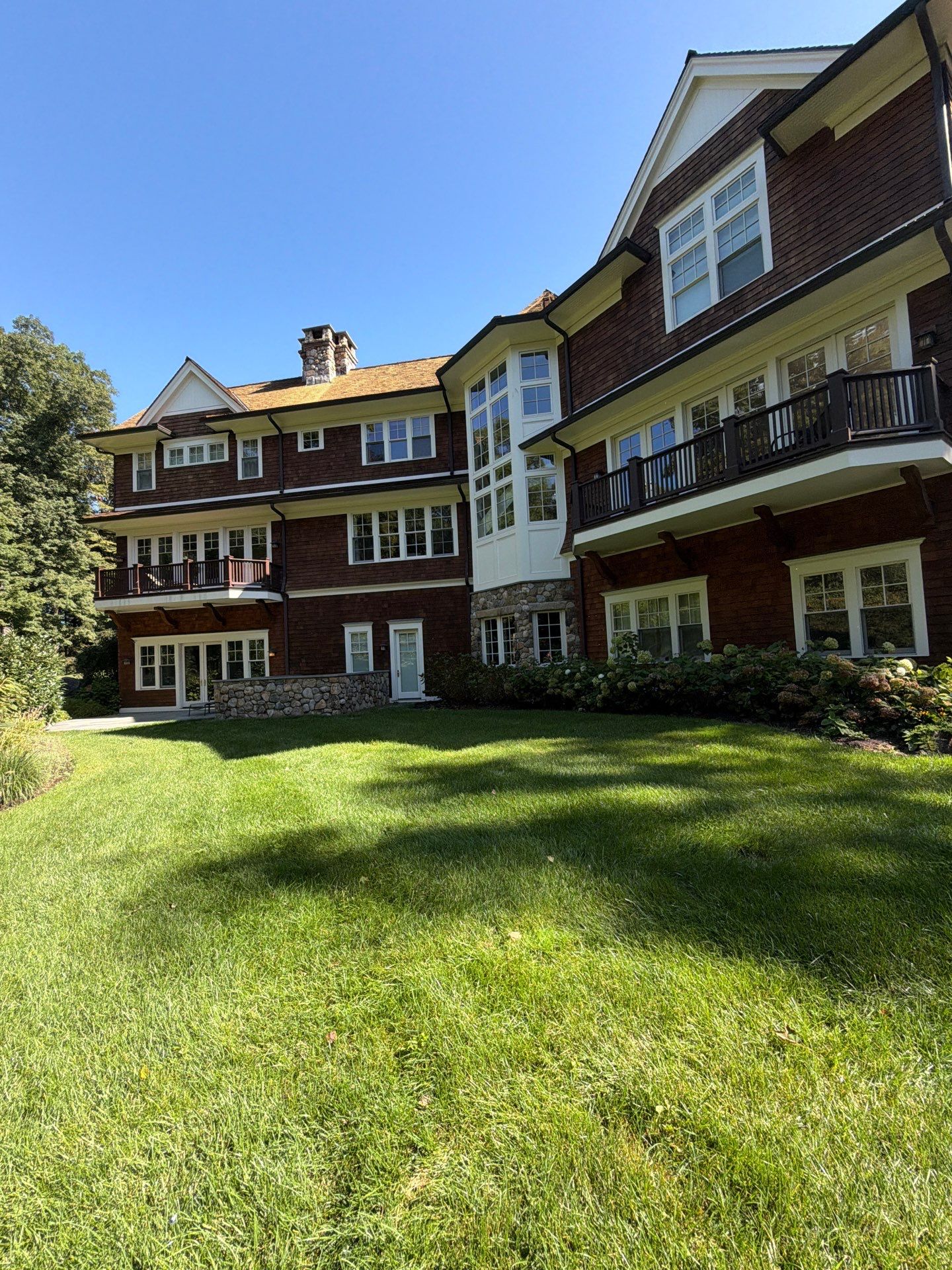 Exterior residential home painting and stained wood beam porch accents